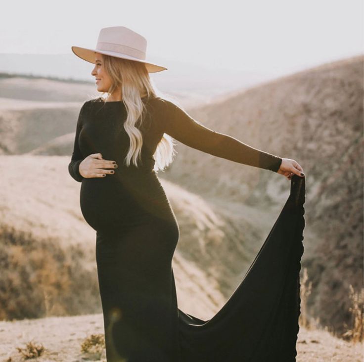 women wearing elegant black maternity gown