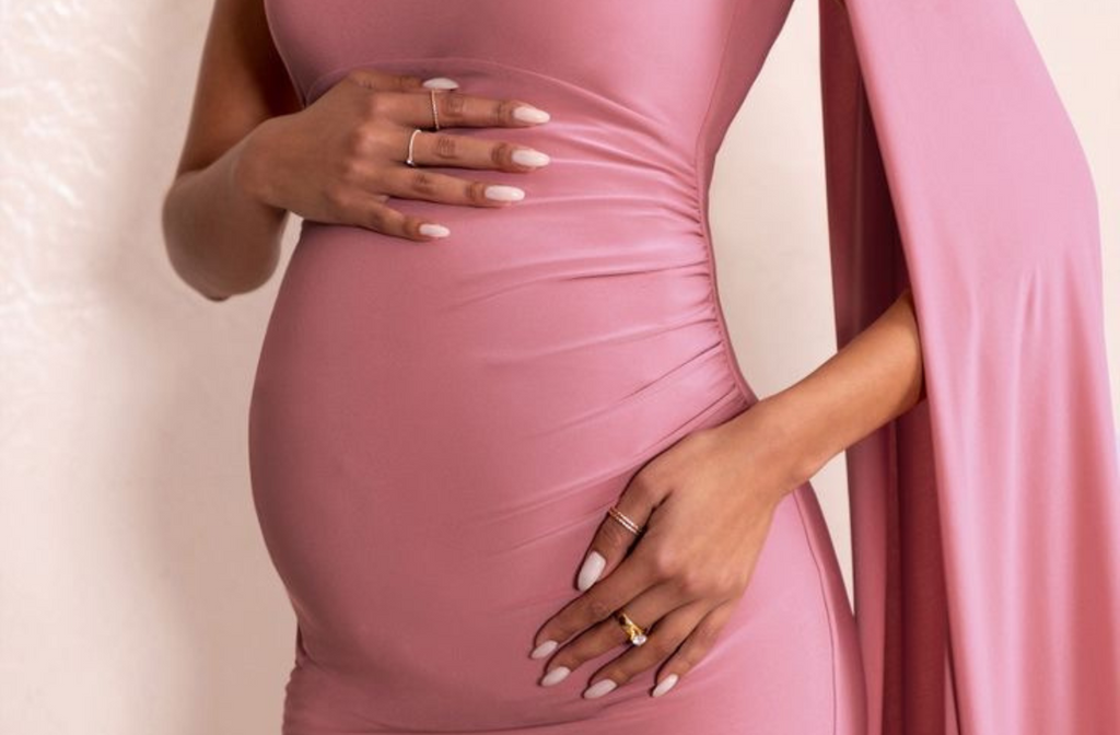 pregnant women wearing pink maternity long dress